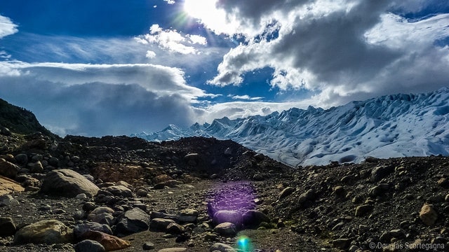 Snowy and rocky landscape with a blue sky