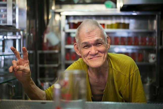 Old man in food stall