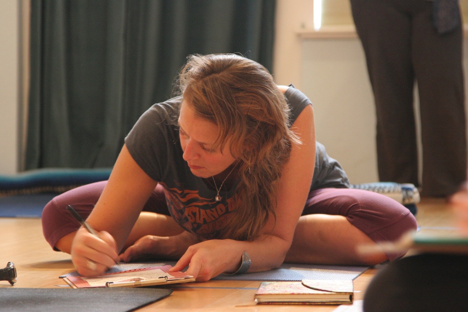 Girl sitting on floor working