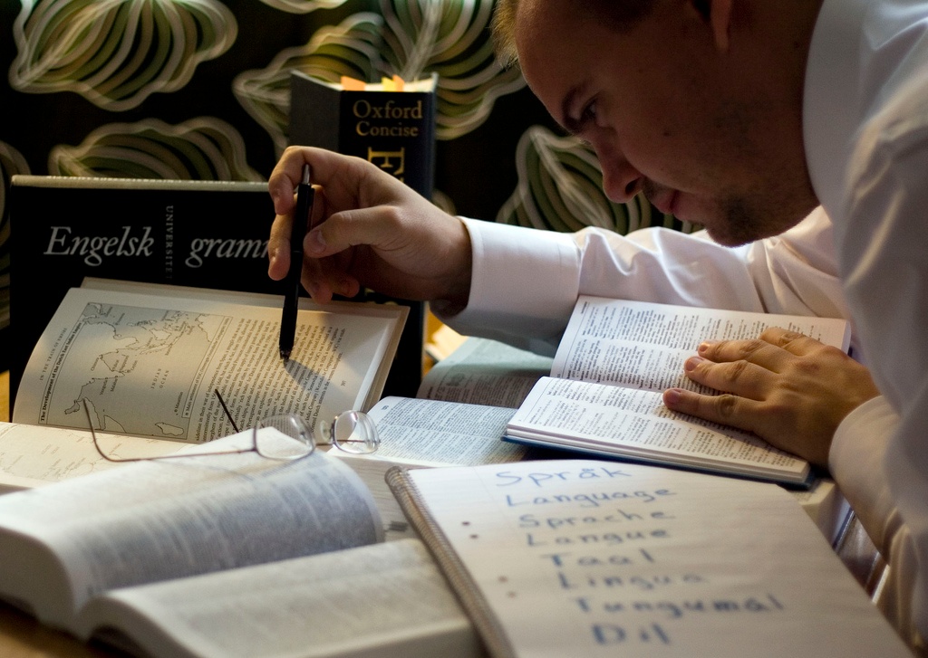 Person studying with lots of books