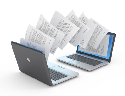 Documents being transferred between laptops for translation