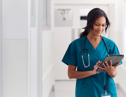 healthcare worker looking at a tablet